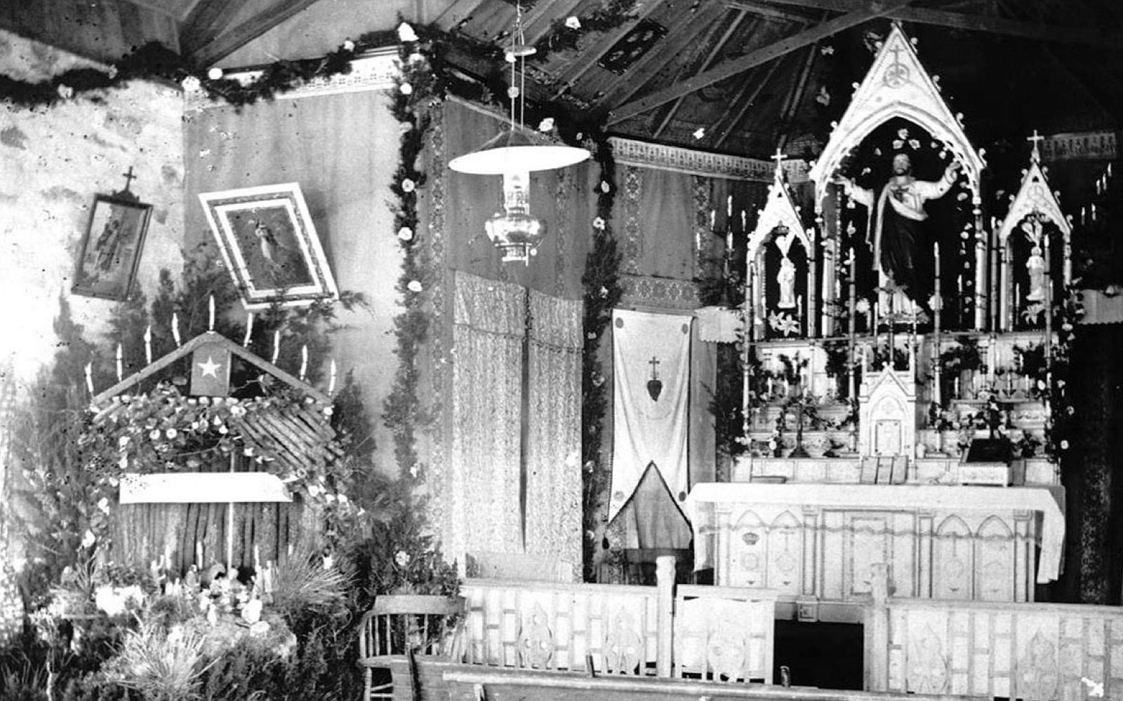 Early 1900s Interior of 1899 church. Note the statue of Sacred Heart (Jesus).