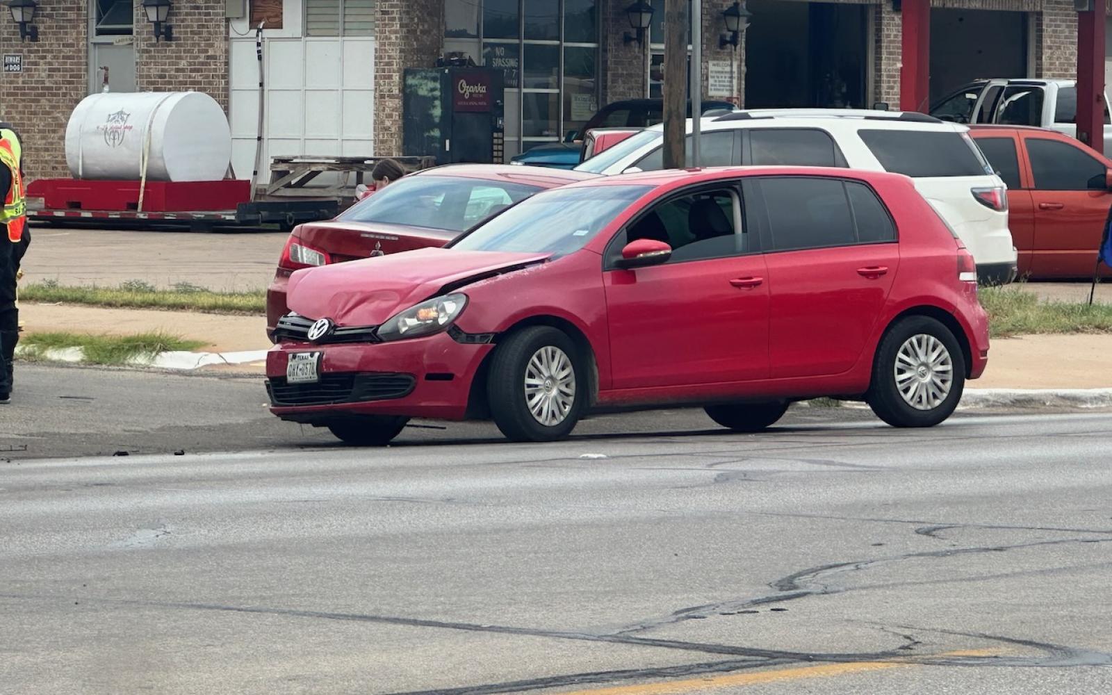 A red Mitsubishi sedan was T-boned by the red Volkswagen hatchback on Sept 12, 2023.