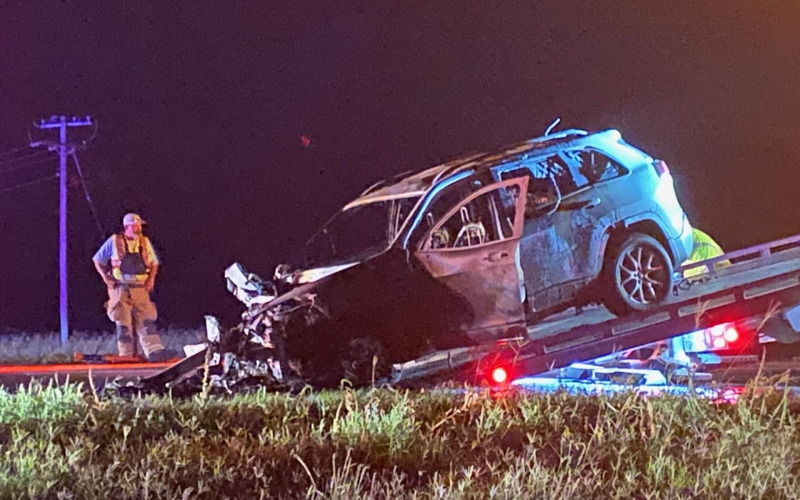 A vehicle, resembling a Chevrolet Equinox, was entirely engulfed in flames following a collision with a larger SUV on U.S. 87 S at the Hawk Ave. crossing on Oct. 1, 2023.