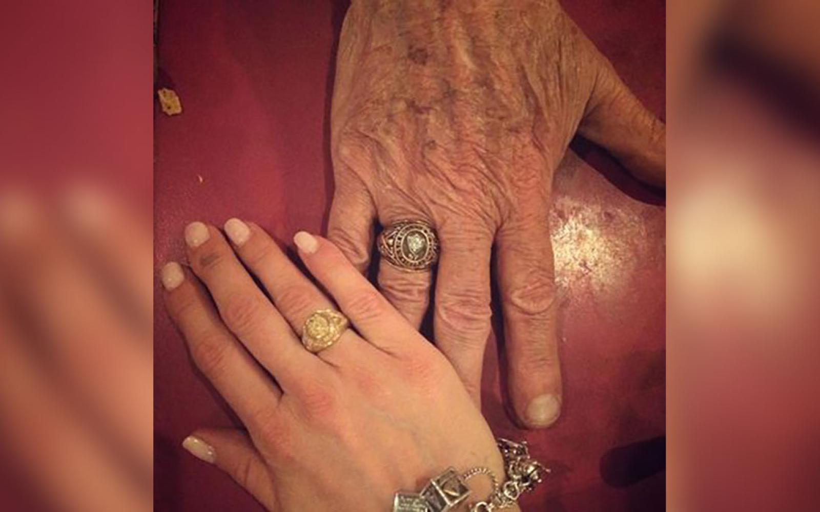 Grandfather Bob Isaacks and granddaughter Stephanie Holan show their Aggie rings. Isaacks was a 1957 graduate of A&M.