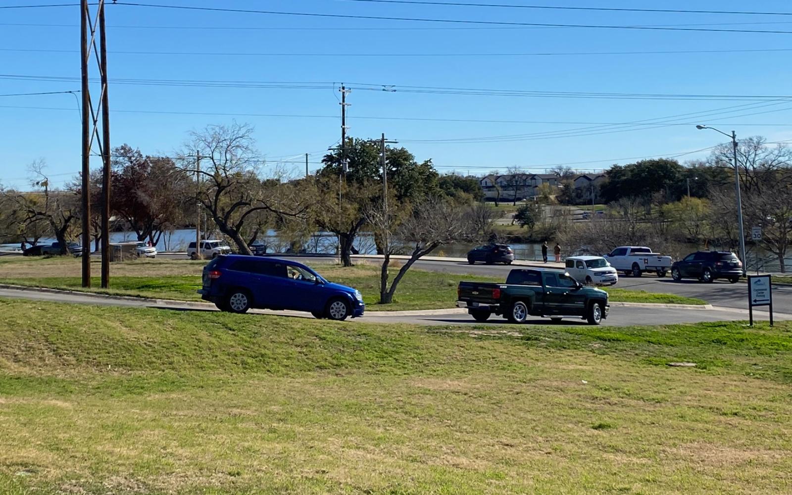 A crowd is arriving to watch the commotion.