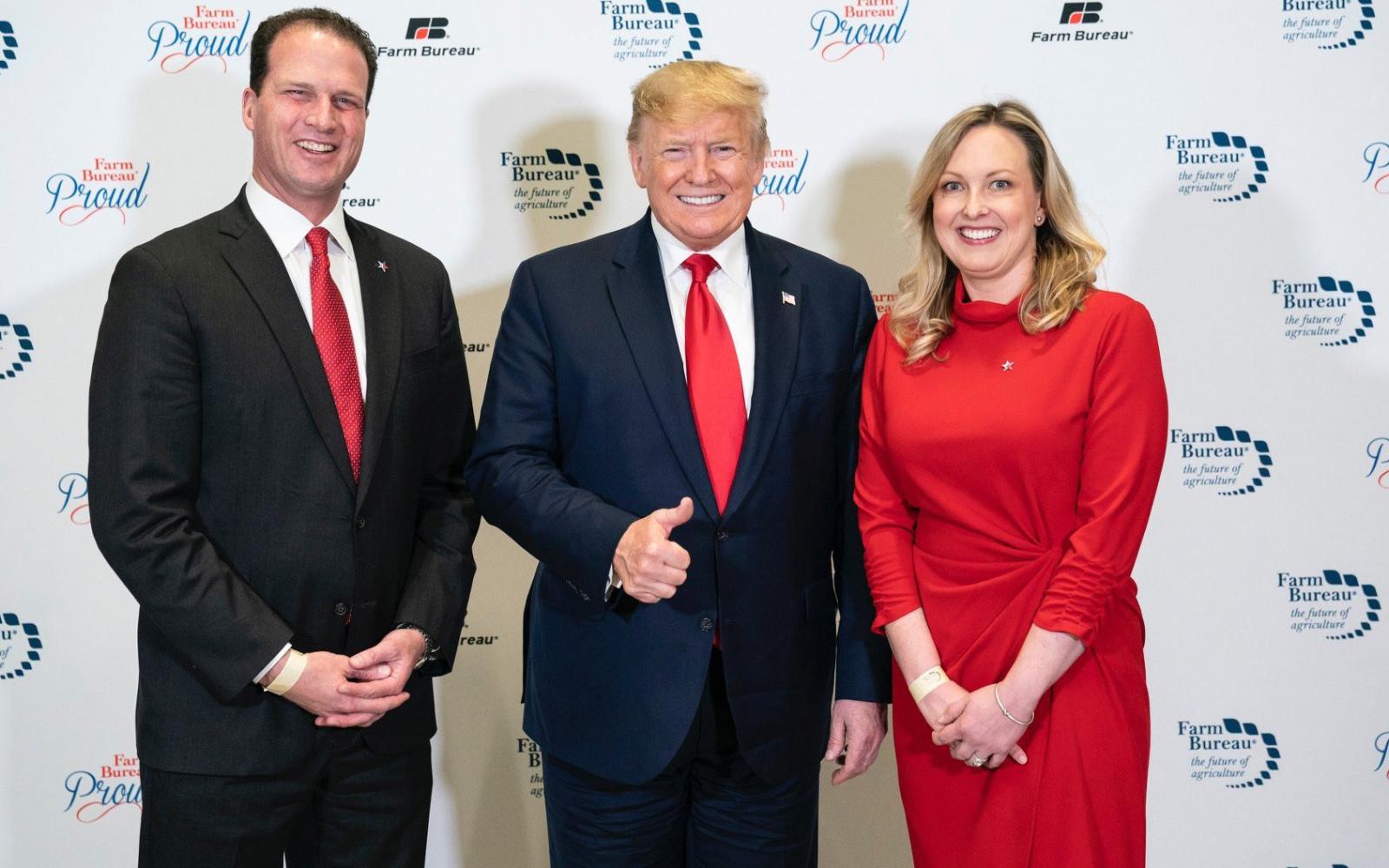 Rep. August Pfluger (left) with Donald Trump and Pfluger's wife, Camille (right).