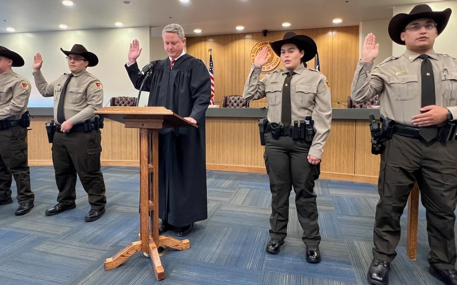 Court at Law #2 Judge Andrew Graves leads the Oath of Office for the four new deputies on June 24, 2024.