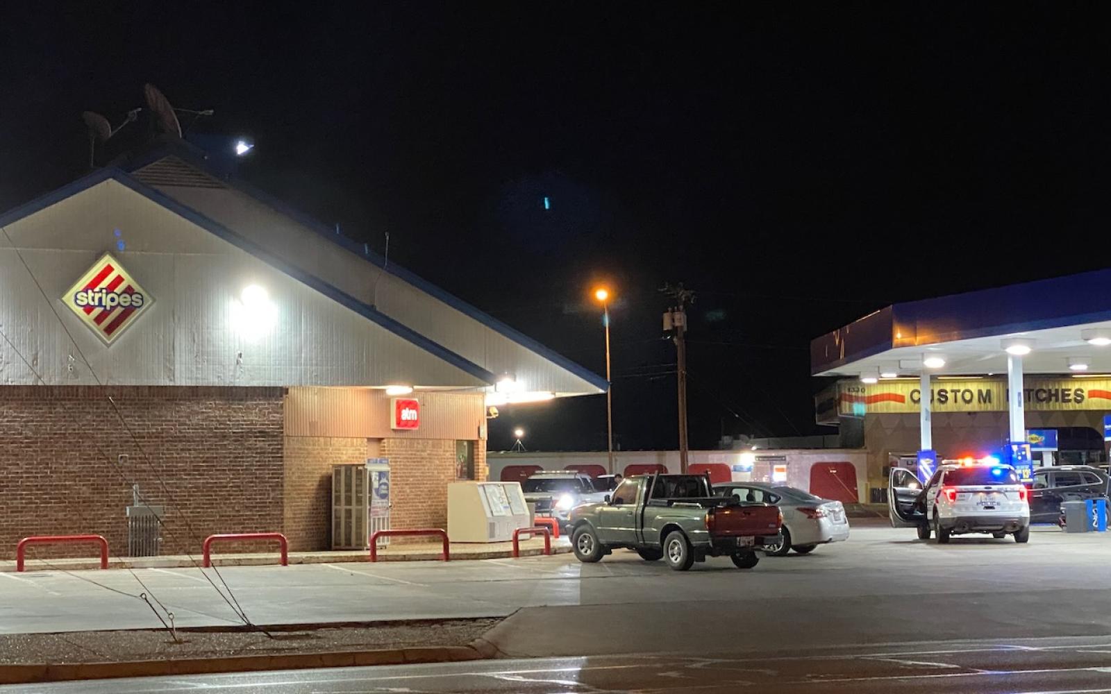 The police perimeter extended into the Stripes Convenience Store's parking lot from the Cross Keys Apartment on June 1, 2024.