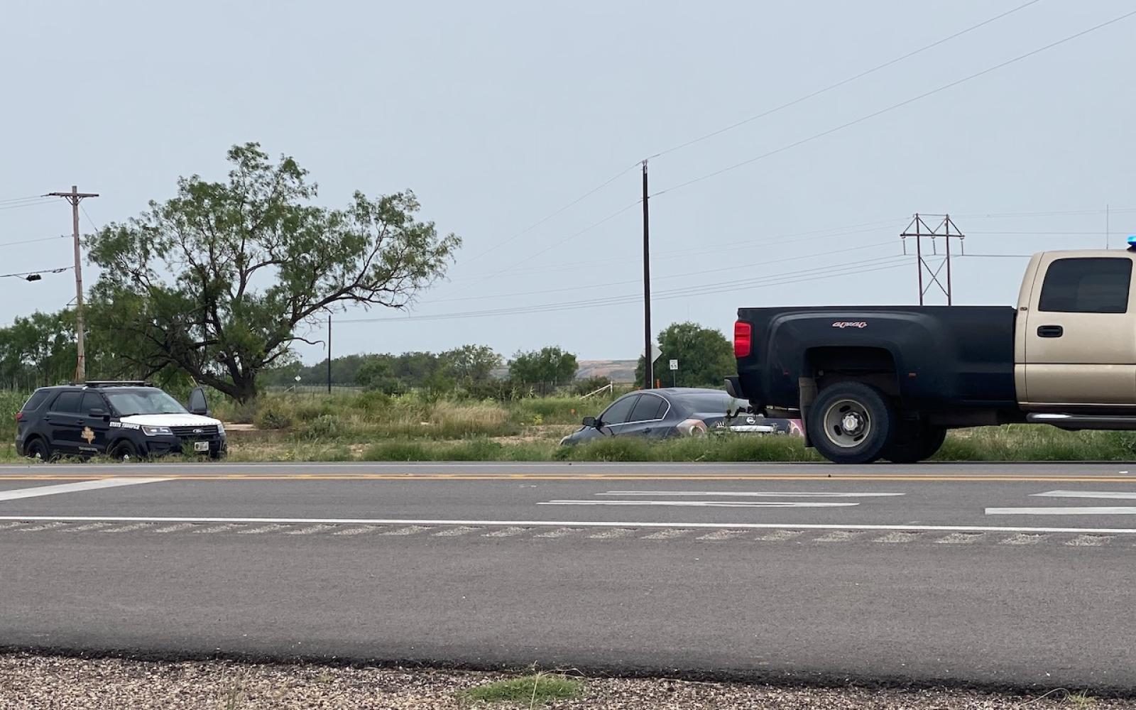 Altima Clips an Infiniti and Winds Up in a Ditch