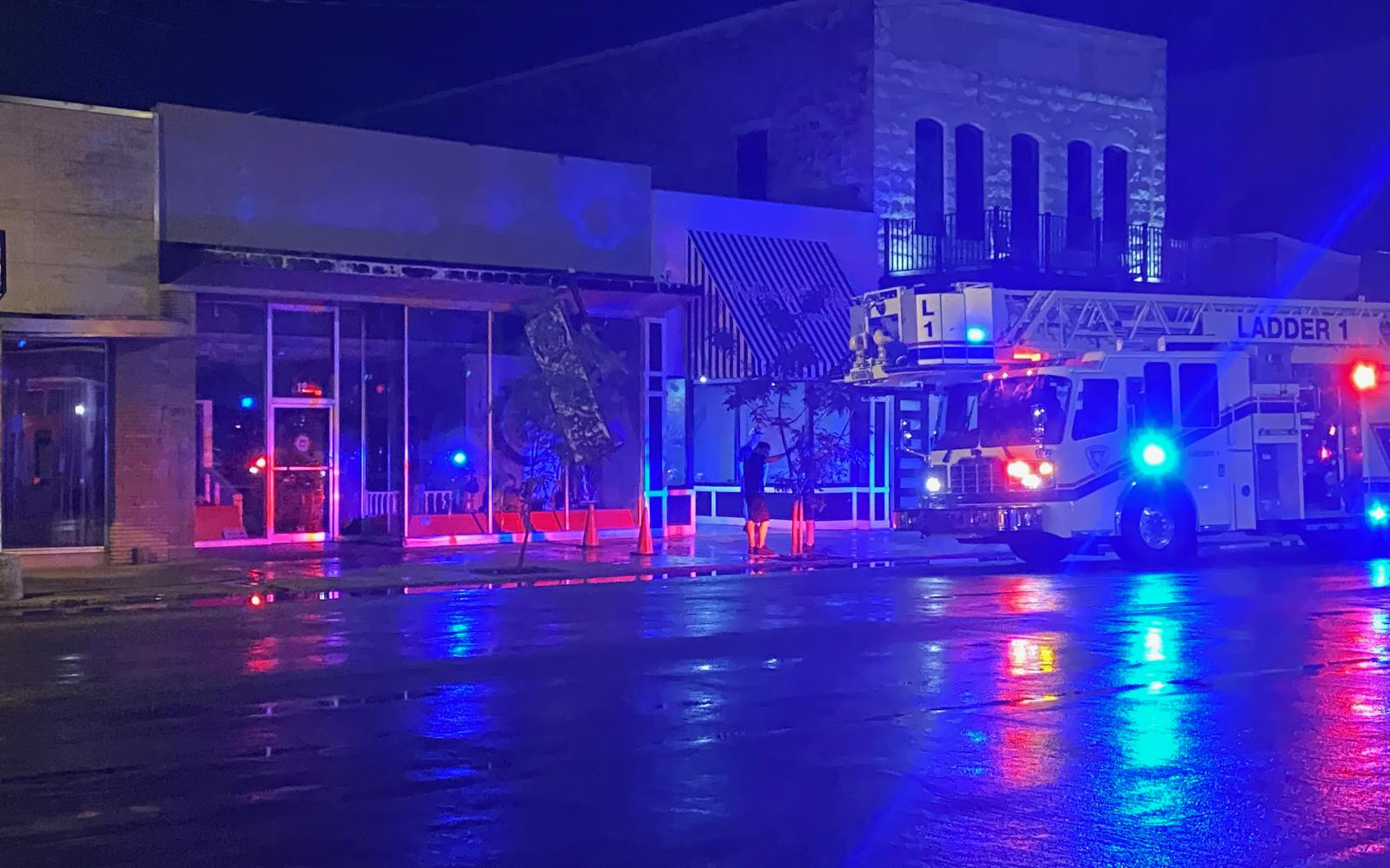 Sign on Downtown Building Falls