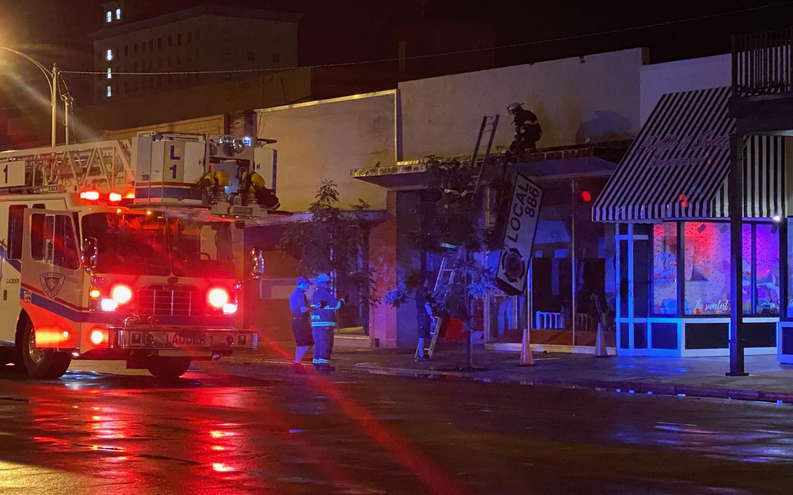 Sign on Downtown Building Falls