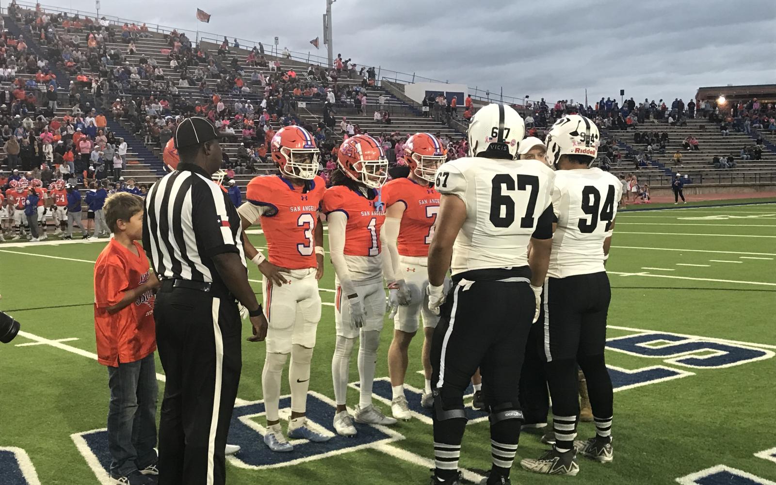 The Central Bobcats and Odessa Permian captains meet at midfield before their game at San Angelo Stadium on Friday, Oct. 18, 2024.