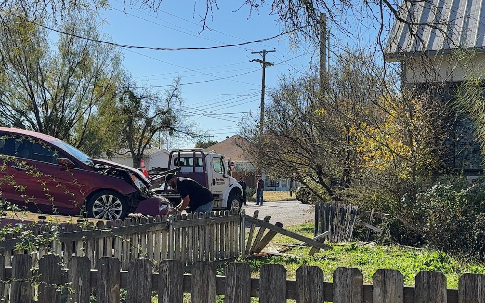 the wrecked red sedan is loaded up by Home Motors on Dec 19, 2024.