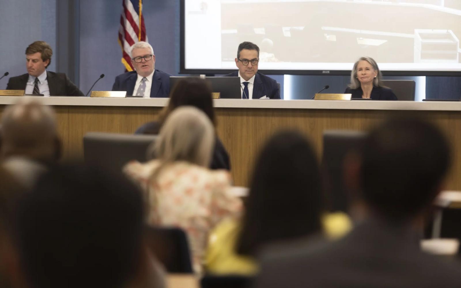 Members of the Texas Lottery Commission sit at the front of the room during a Texas Lottery Commission meeting on April 29, 2025.