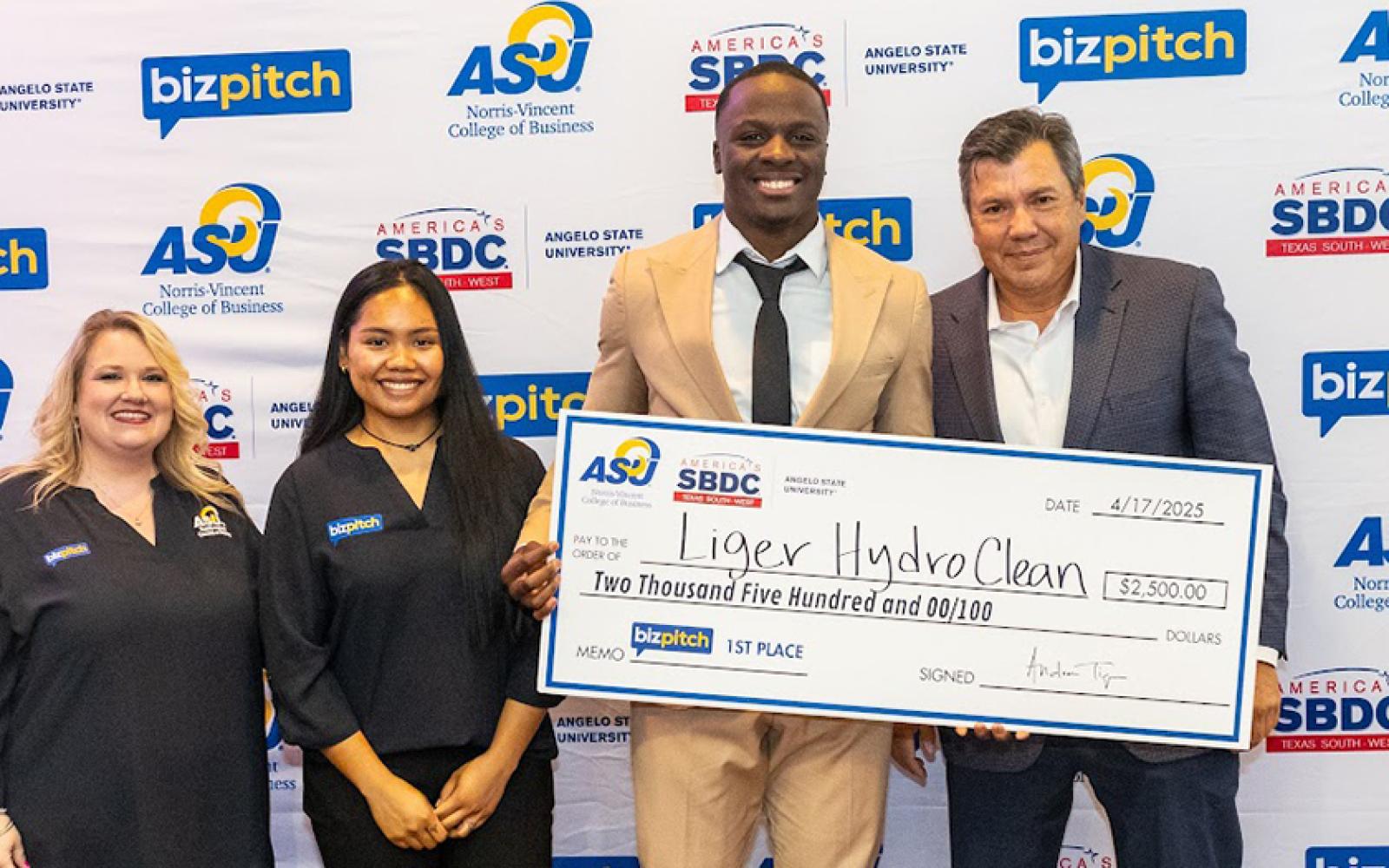 (L-R) SBDC Director Dezaray Johnson, Inglai Hangaripaii (SBDC grad student), Eugene Liger III, NVCOB Dean Dr. Andrew Tiger. 