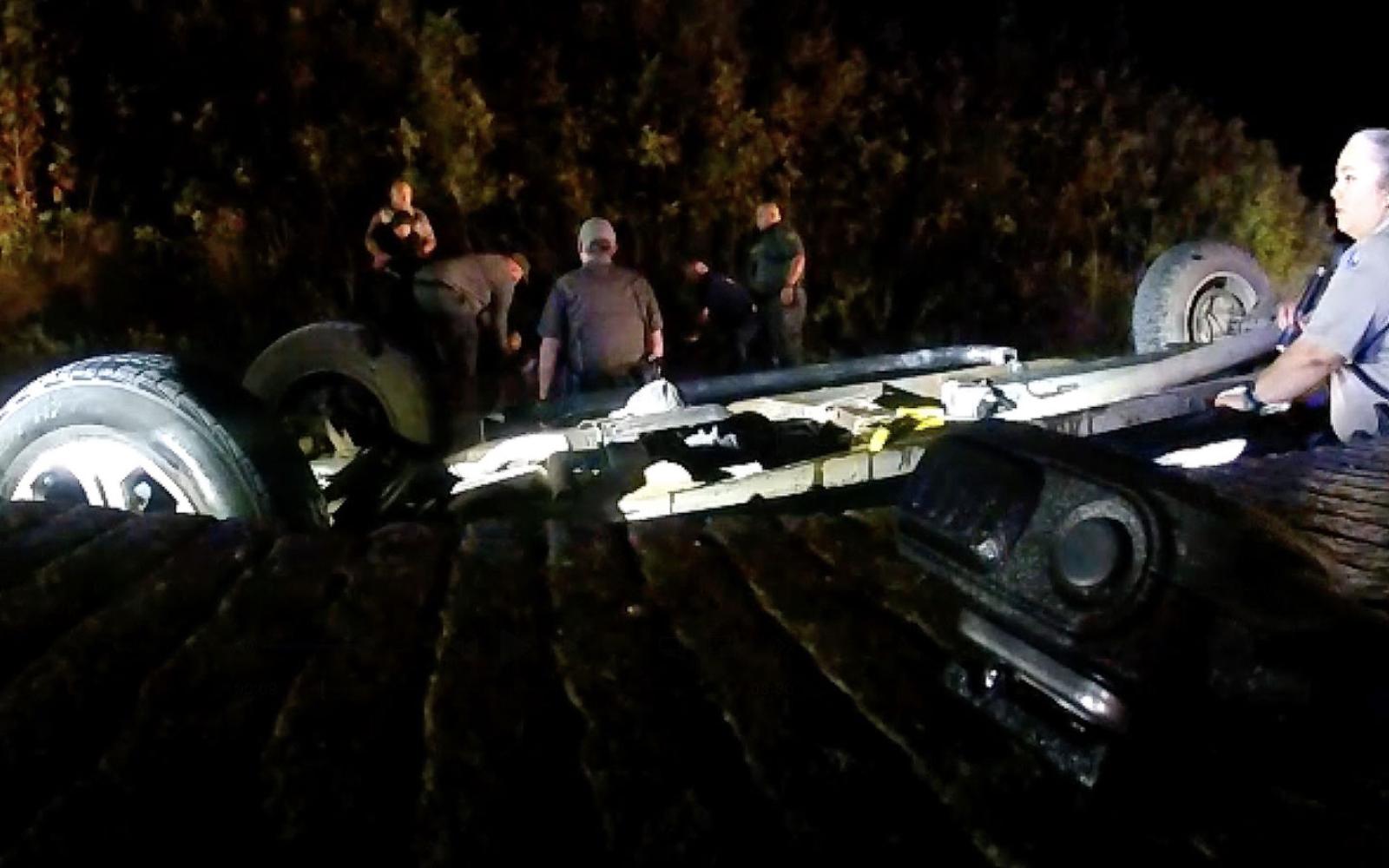 The overturned pickup in the South Llano River with 5 illegal migrants and the human trafficker as first responders attempted to rescue them in Oct. 2022.