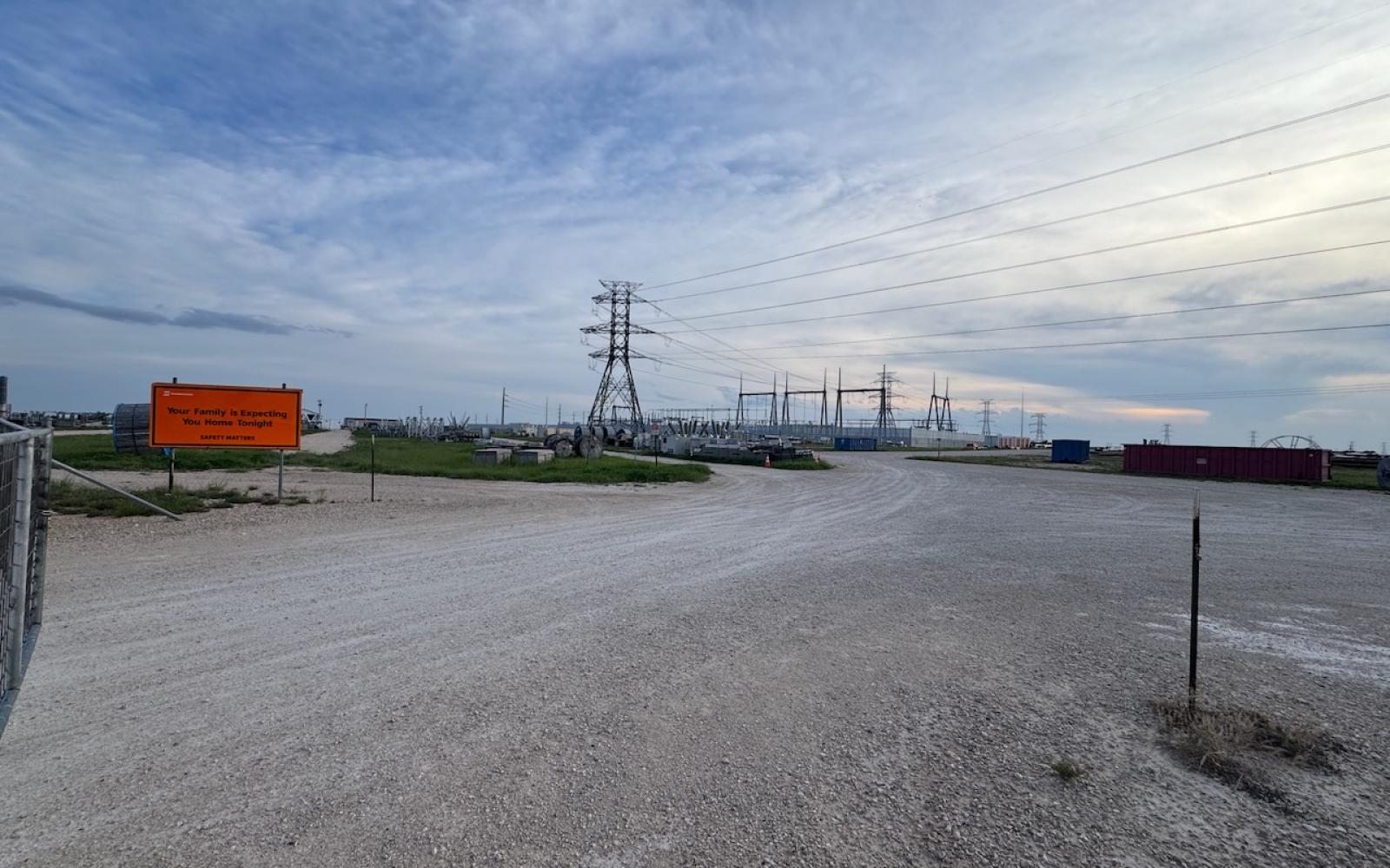 A long line of high voltage power transmission lines converge at the AEP Red Creek Substation.