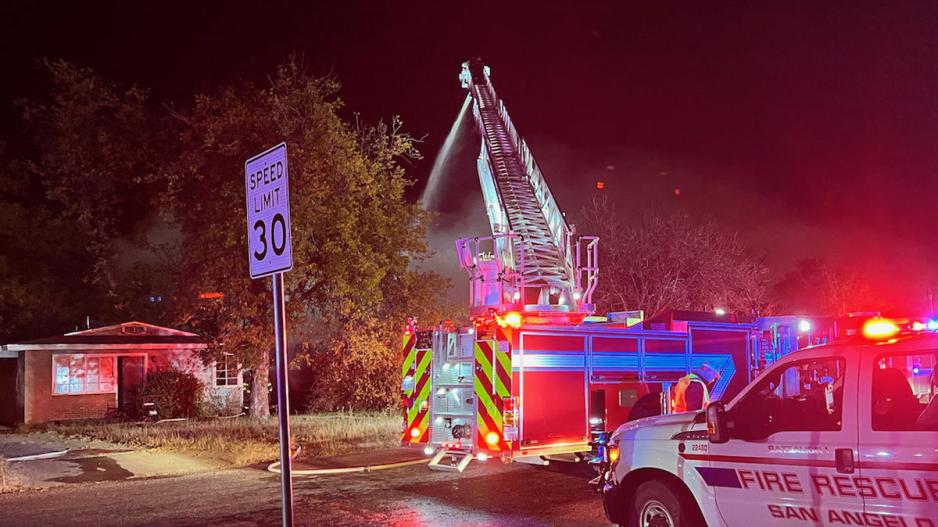 A red car was damaged by flames. San Angelo firefighters battled a fully-engulfed house fire on the evening of Sunday, Nov. 28, 2021 A red car was damaged by flames. San Angelo firefighters battled a fully-engulfed house fire on the evening of Sunday, Nov. 28, 2021