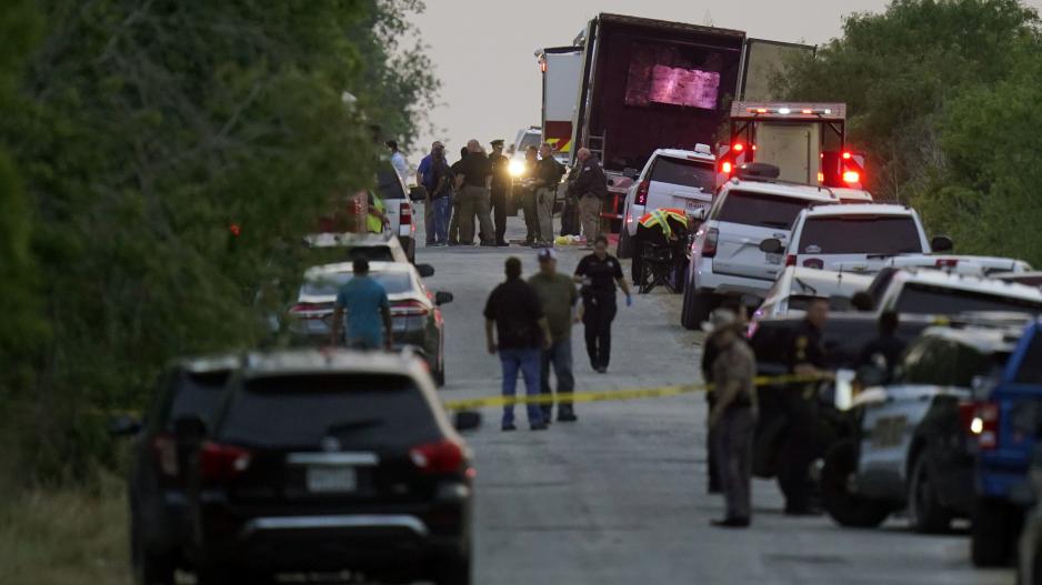Police and other first responders work the scene where officials say dozens of people have been found dead and multiple others were taken to hospitals with heat-related illnesses after a semitrailer containing suspected migrants was found, Monday, June 27, 2022, in San Antonio. (AP Photo/Eric Gay) Police and other first responders work the scene where officials say dozens of people have been found dead and multiple others were taken to hospitals with heat-related illnesses after a semitrailer containing suspected migrants was found, Monday, June 27, 2022, in San Antonio. (AP Photo/Eric Gay)