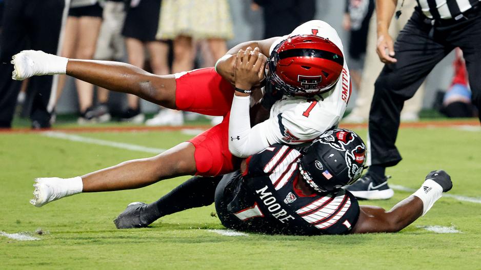 Texas Tech's Donovan Smith is sacked for a loss by North Carolina State's Isaiah Moore during the first half of an NCAA college football game in Raleigh, N.C., Saturday, Sept. 17, 2022. (AP Photo/Karl B DeBlaker) Texas Tech's Donovan Smith is sacked for a loss by North Carolina State's Isaiah Moore during the first half of an NCAA college football game in Raleigh, N.C., Saturday, Sept. 17, 2022. (AP Photo/Karl B DeBlaker)