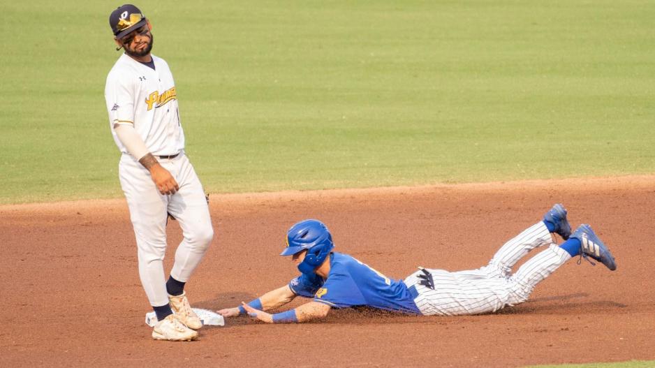 Jackson Hardy dives for the base. Jackson Hardy dives for the base.