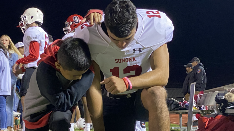 Buitron Prays before the Area Round Matchup against the Farwell Steers Buitron Prays before the Area Round Matchup against the Farwell Steers