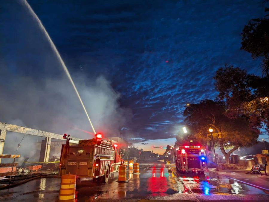 Firefighters cleaning up hot spots early this morning May 27 after the May 26, 2024 Alpine Downtown Fire.