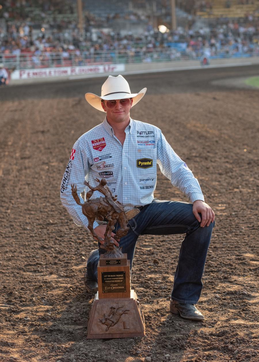 Dylan Hancock of San Angelo, Texas, holds the East Oregonian Let ‘er Buck Trophy for winning the all-around title on Sept. 13, 2025, at the Pendleton Round-Up finals. (Yasser Marte/East Oregonian) Read more at: https://eastoregonian.com/2025/09/14/unforgettable-rodeo-glory-at-pendleton-round-up-finals/ Dylan Hancock of San Angelo, Texas, holds the East Oregonian Let ‘er Buck Trophy for winning the all-around title on Sept. 13, 2025, at the Pendleton Round-Up finals. (Yasser Marte/East Oregonian) Read more at: https://eastoregonian.com/2025/09/14/unforgettable-rodeo-glory-at-pendleton-round-up-finals/