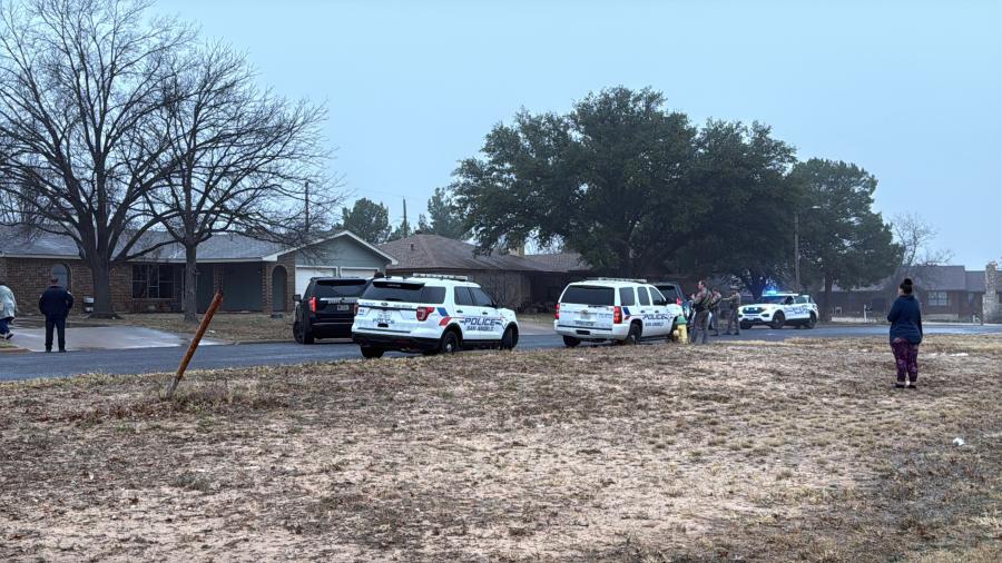 Law enforcement has surrounded a house in a San Angelo neighborhood after a car chase Friday morning.