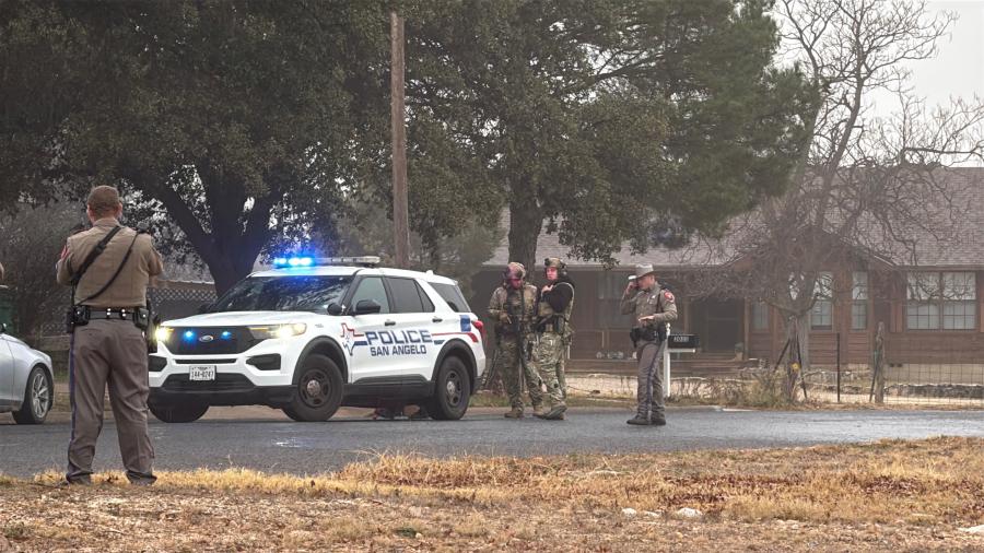 Law enforcement has surrounded a house in a San Angelo neighborhood after a car chase Friday morning.
