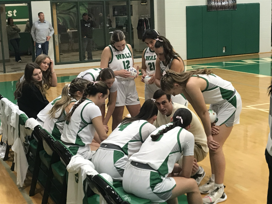Wall girls basketball coach Silas Crisler talks to his team before their game against Jim ned on Tuesday, Jan. 20, 2026.