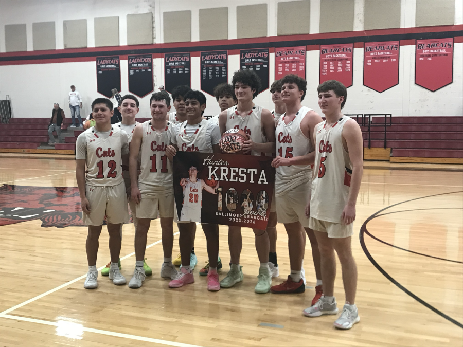 Hunter Kresta and his teammates celebrate the Ballinger junior scoring his 1,000th career point Wednesday against Miles.