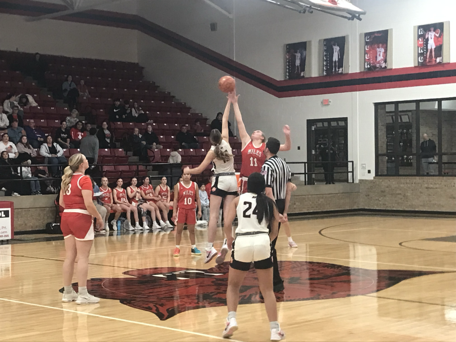 Ballinger's Ysee Le Borgne and Miles' Rylee Vanlenkamp jump for the opening tip Wednesday, Jan. 28, 2026, in Ballinger.