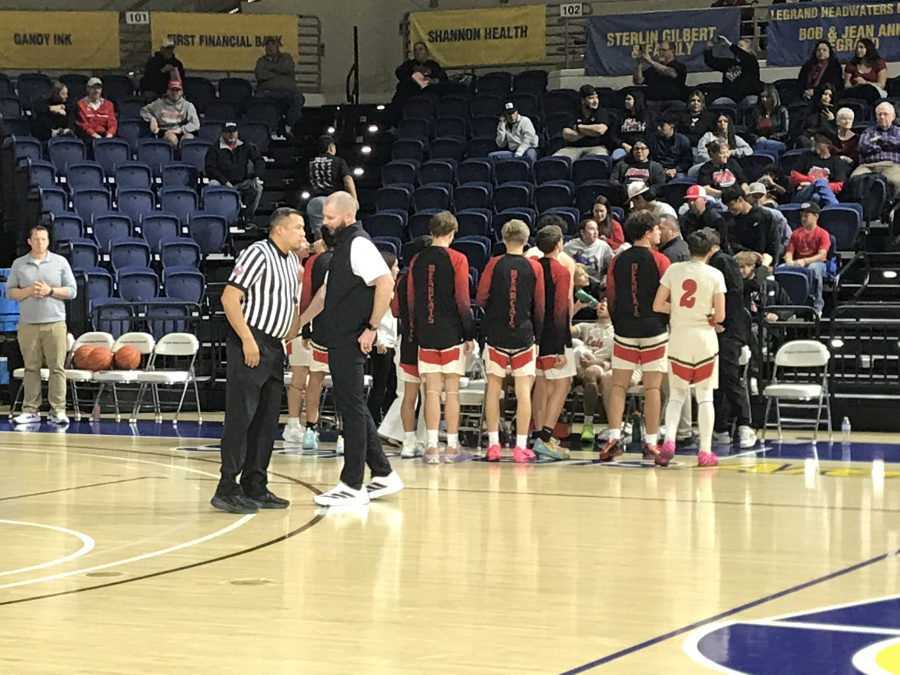 Ballinger head coach Jeff Holland talks to the referee during a timeout in the Bearcats' first-round playoff game against Forsan on Monday, Feb. 23, 2026.