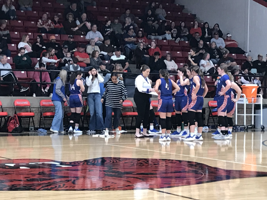 Coleman girls head coach Taylor Neal talks to her team during a timeout in Ballinger on Tuesday, Feb. 10, 2026.