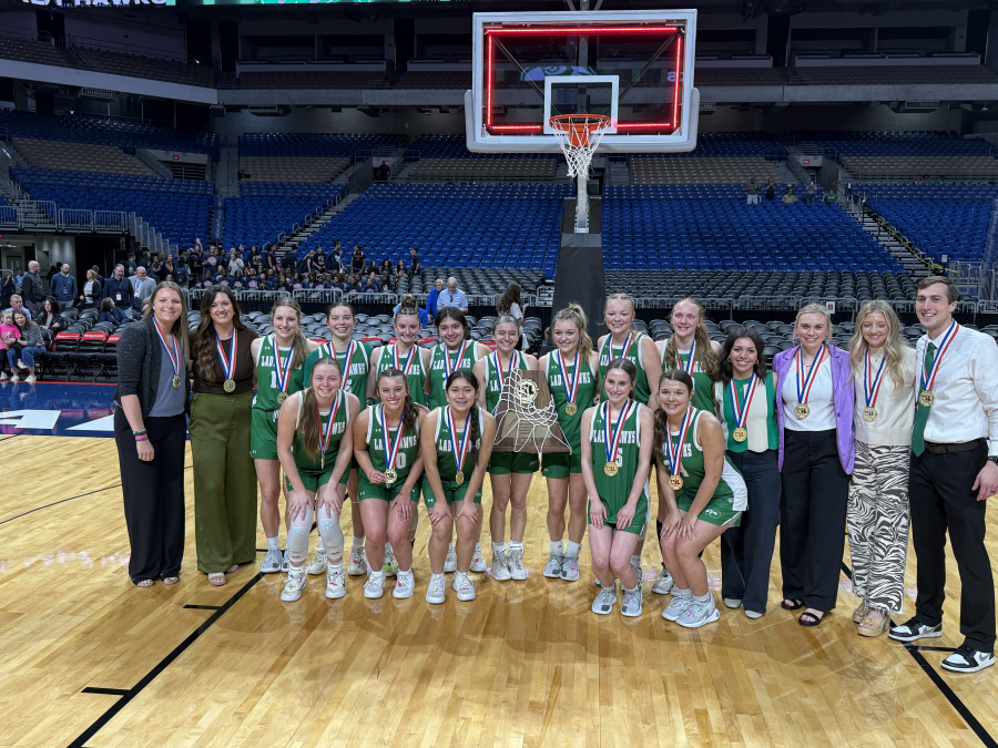 The Wall girls basketball team poses with its championship trophy after defeating Central Heights 49-34 in the Class 3A Division II state final Monday, March 6, 2026, at the Alamodome in San Antonio.