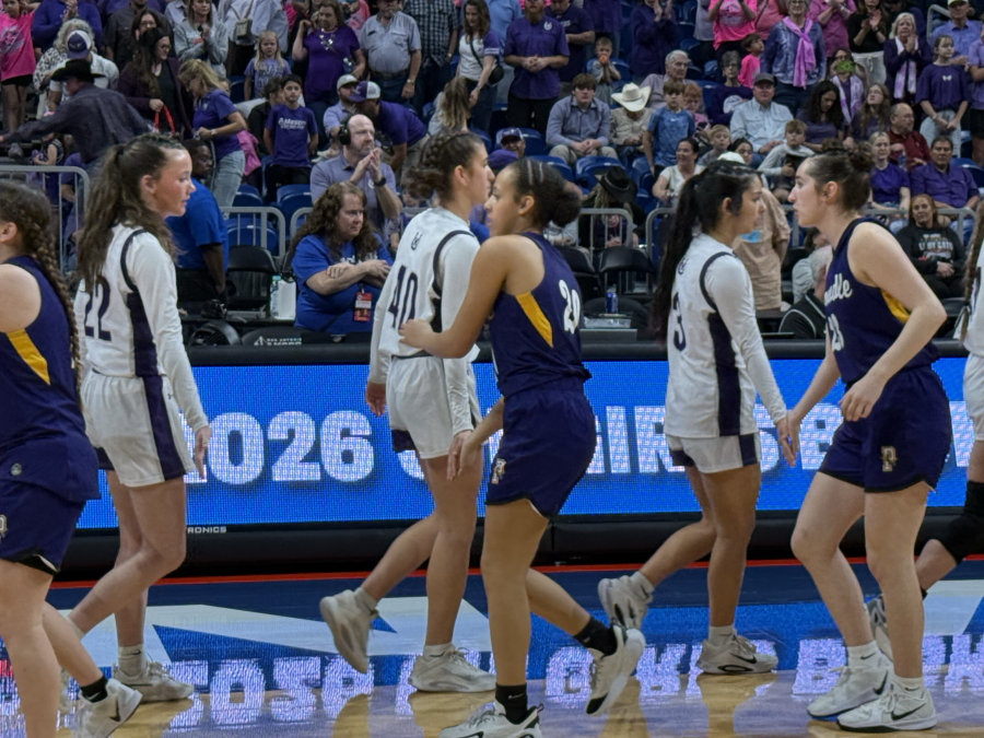 The Mason and Panhandle girls basketball teams shake hands after the state final Thursday, March 5, 2026, at the Alamodome in San Antonio.