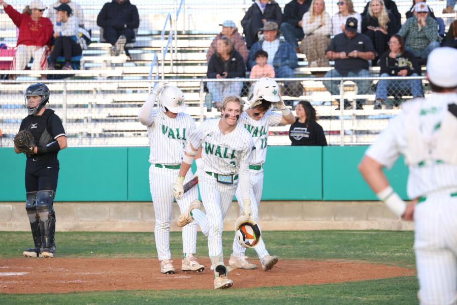 Kellan Oliver (center) went 4-for-4 with two home runs to lead the No. 5-ranked Wall baseball team to a win over Clyde on Tuesday.