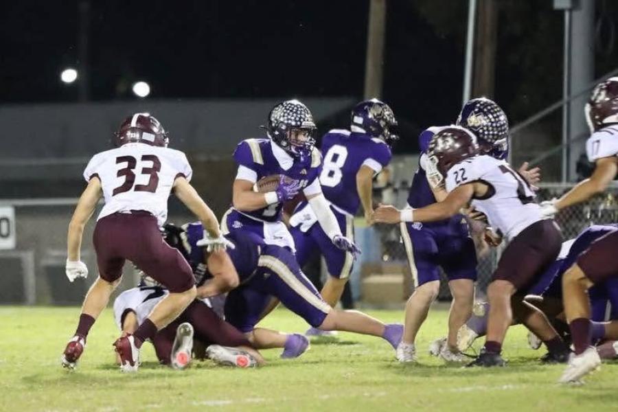 San Saba quarterback Luke Tharp runs for yardage during the 2025 season.