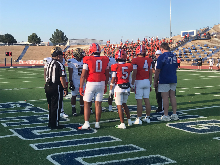 Centarl captains Riley Oines (0), Troy Ceballos (5), Micah Smith (4) and Ethan Boyd (75) meet Abilene High's captains at midfield for the coin toss before their game Friday, Aug. 28, 2026, at San Angelo Stadium.