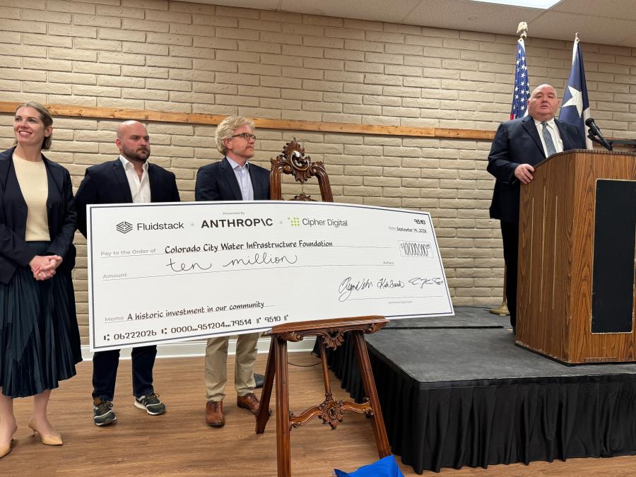 Colorado City Mayor Ruben Hurt is at the podium. To his right, from left to right, are Fluidstack's Kate Franco, Anthropic's Ryan Wilson, and Cipher Digital CEO Tyler Page. (LIVE! Photo/Joe Hyde)