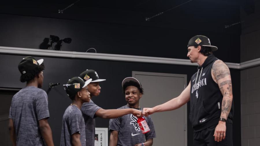 Chicago White Sox pitcher Davis Martin talks with young baseball players he helps mentor during the 2026 season.