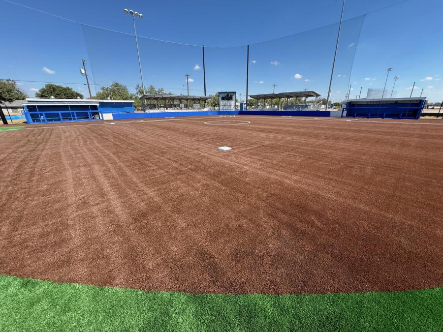 The artificial turf at the girl's softball diamond. Note the different colors of the astroturf.