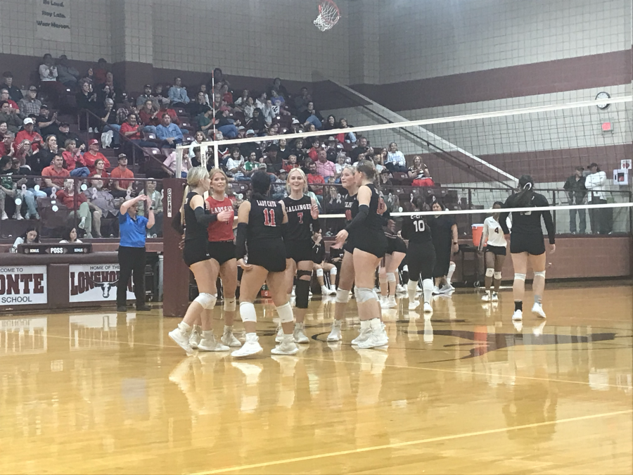 The Ballinger volleyball team celebrates a point during its first-round playoff match against Colorado City on Thursday, Oct. 29, 2026.