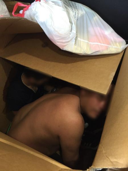 Illegal Aliens Smuggled in Cardboard Boxes.  CBP Image