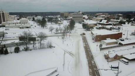 This drone photo was taken 2 days later 2 miles up State Line from where Peek filmed the infamous Feb. 16 video. The Arkansas road-grader repurposed as a snow plow was just arriving. On this section of the road, Arkansas was late plowing.