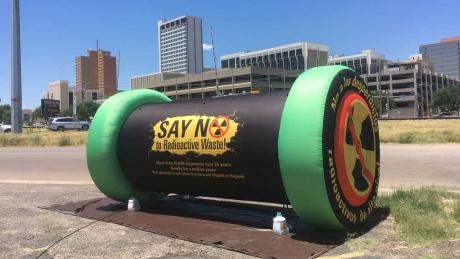 In 2019, protesters in Midland inflate a mock spent nuclear fuel cask to show the size of the containers that may be brought by train or to Waste Control Specialists’ facility in Andrews County.