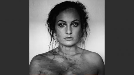 Singer/Songwriter Kat Hasty's album cover for "Drowning in Dreams" was taken with her iPhone after a day working as a face painter.