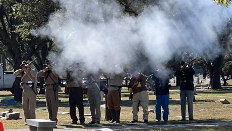 Sons of Confederate Veterans and Sons of Union Veterans perform a 21-gun salute at the Veterans Day memorial service at Fairmount Cemetery on Nov. 11, 2021