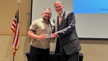 Manny Diaz accepts the 2021 Diversity Communicator of the Year award from San Angelo Chamber of Commerce President Walt Koenig. 