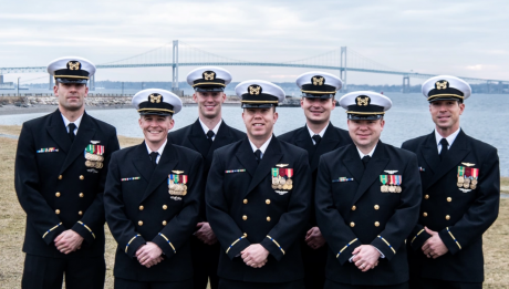 Warrant Officer 1 James Goodyear, Thomas Forsythe, Devin Layser, Matthew Brickley, Jacob Mettlen, Christopher Nolan and Kiel Massong; the first Warrant Officer Aerial Vehicle Operators; assemble at Officer Training Command Newport, (OTCN) Rhode Island, Jan. 25, prior to their graduation from Officer Candidate School (OCS) class 05-22. The class is part of the Navy’s second phasing-in of the Warrant Officer-1 corps. OCS morally, mentally, and physically develops civilians and fleet Sailors into newly commiss
