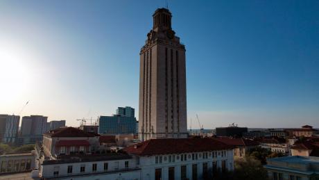 The UT Tower and Main Building on the University of Texas campus, Saturday, Mar. 26, 2022, in Austin. Tex. (Kirby Lee via AP)