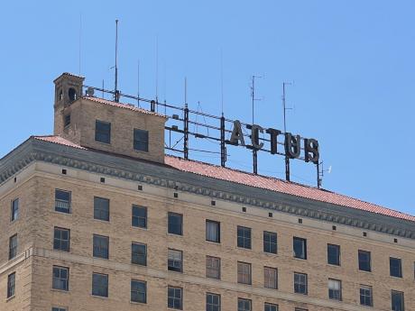The broken sign atop the iconic Cactus Hotel in downtown San Angelo, Texas. 