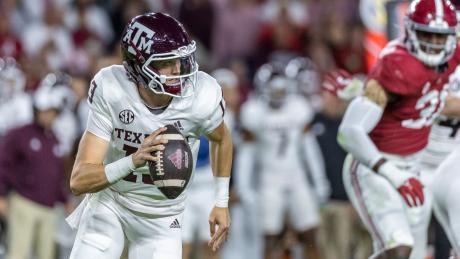 Texas A&M quarterback Haynes King (13) scrambles during the first half of an NCAA college football game against Alabama, Saturday, Oct. 8, 2022, in Tuscaloosa, Ala. (AP Photo/Vasha Hunt)